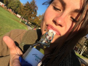 Jennifher holding the new perfume Gypsy Love